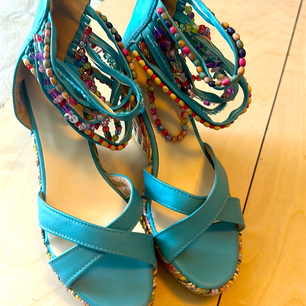 Women’s platform wedge sandals with beaded ankle straps. Never worn.